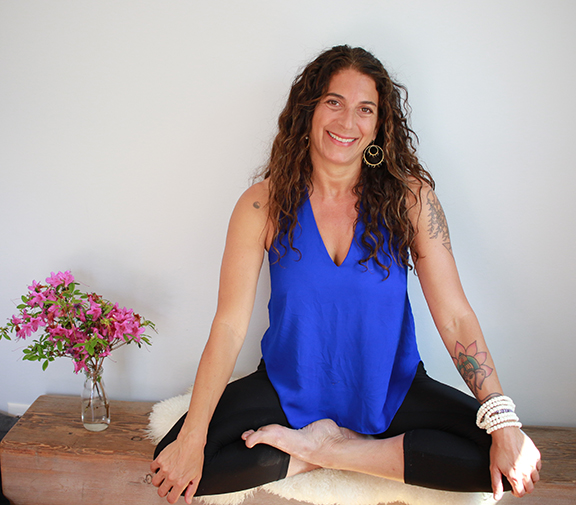 Sherry Sidoti sitting in lotus position